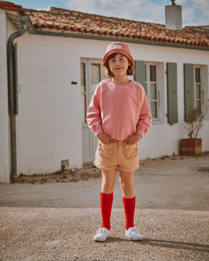 Short poches fleurs uni sésame