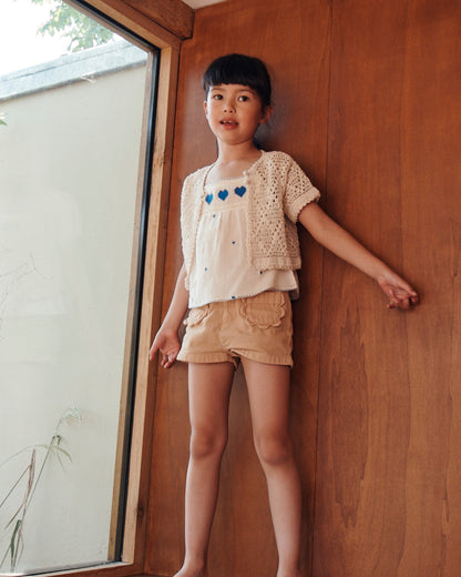 Short poches fleurs uni sésame