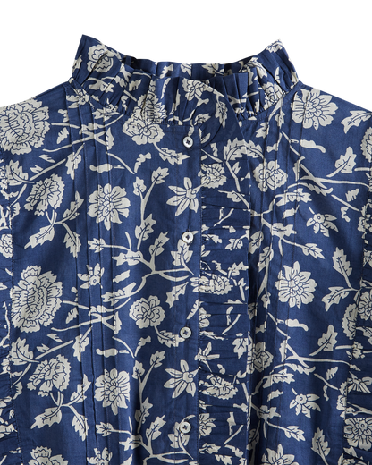 Blouse crop bleue à fleurs blanches