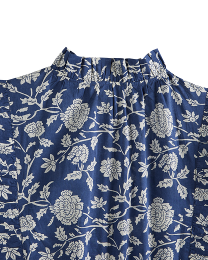 Blouse crop bleue à fleurs blanches