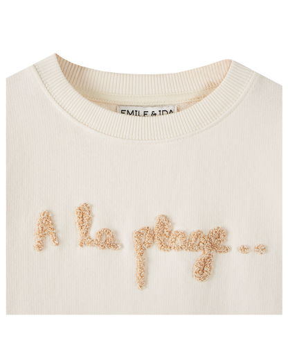 Sweatshirt coton bio molletonné écru "A la plage…"