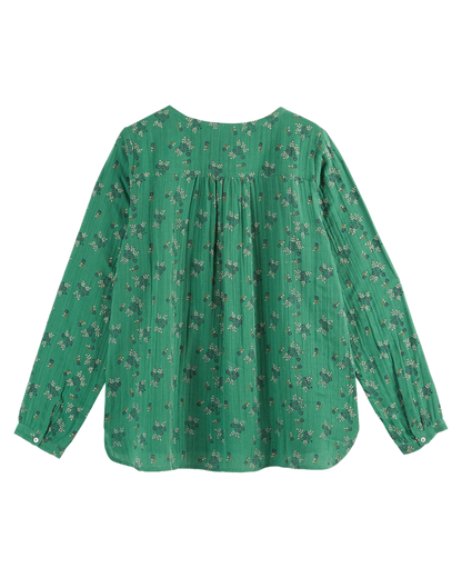 Blouse verte à fleurs blanches