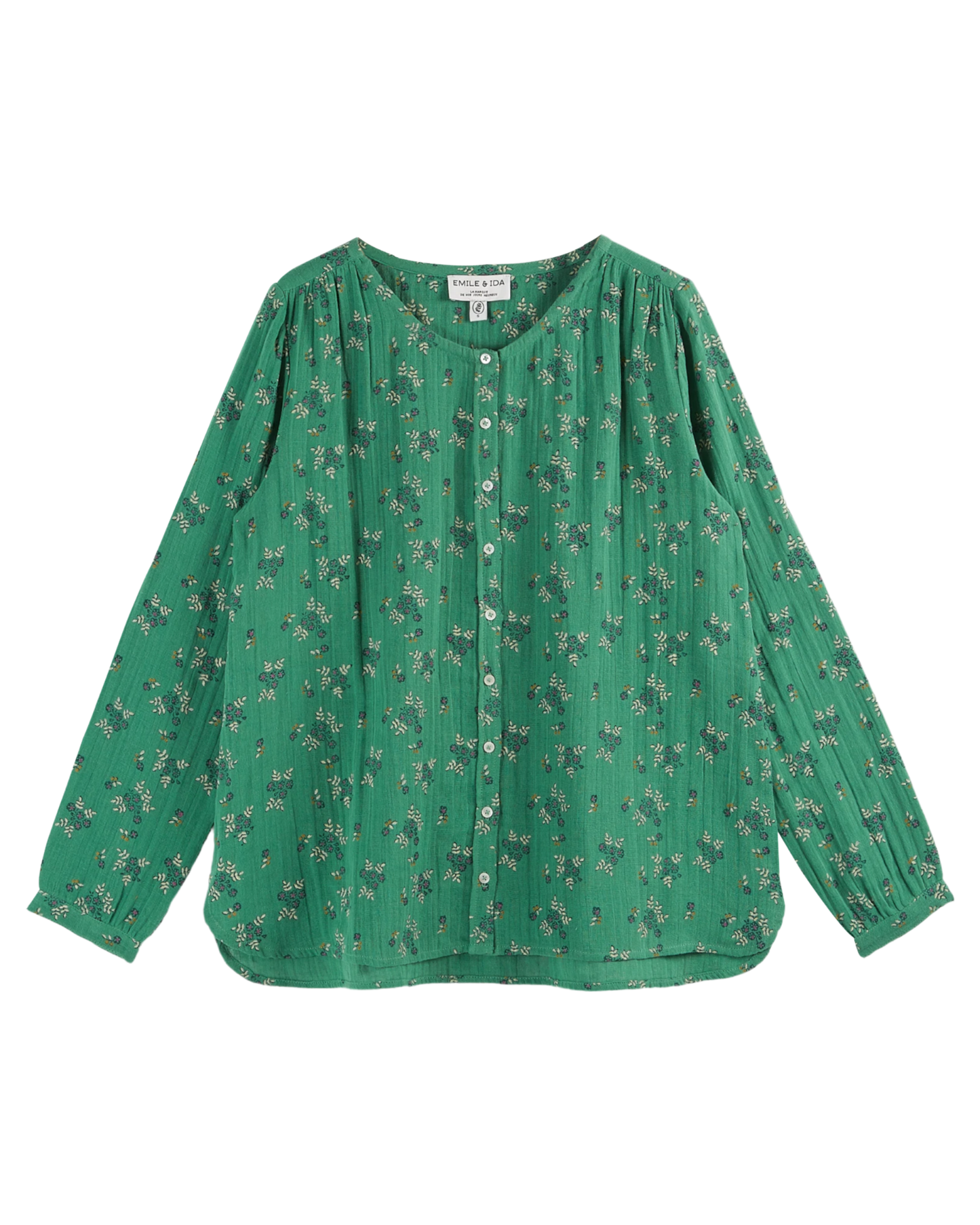 Blouse verte à fleurs blanches