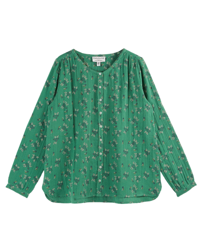 Blouse verte à fleurs blanches