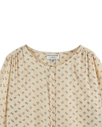 Blouse écrue à fleurs roses